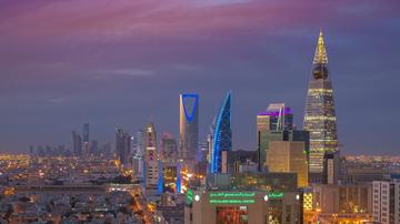 Riyadh at dusk, with the Kingdom Centre, centre, and the Al Faisaliah tower, right